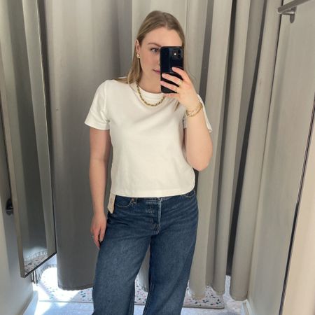 Woman wears white tshirt and blue jeans