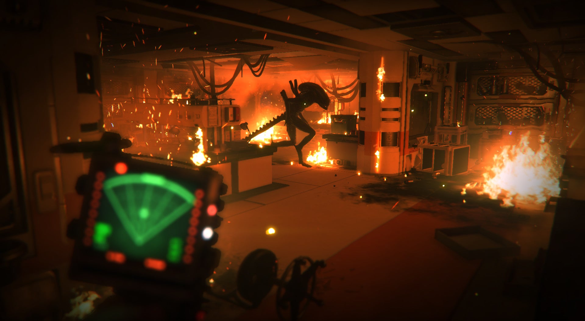 The Xenomorph patrolling in a fire-filled room while the player hides off to the side