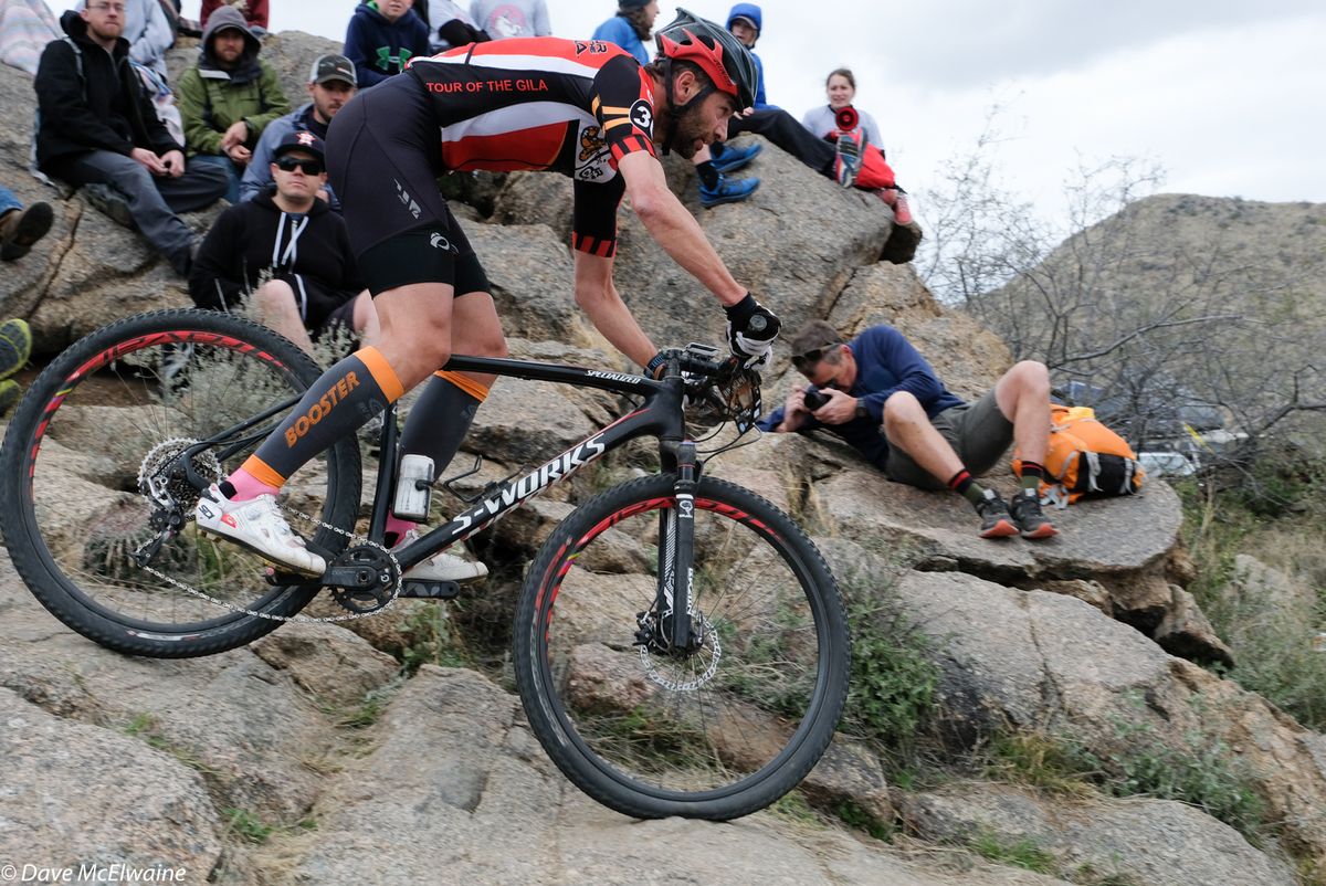 A racer descends the tricky rock drops