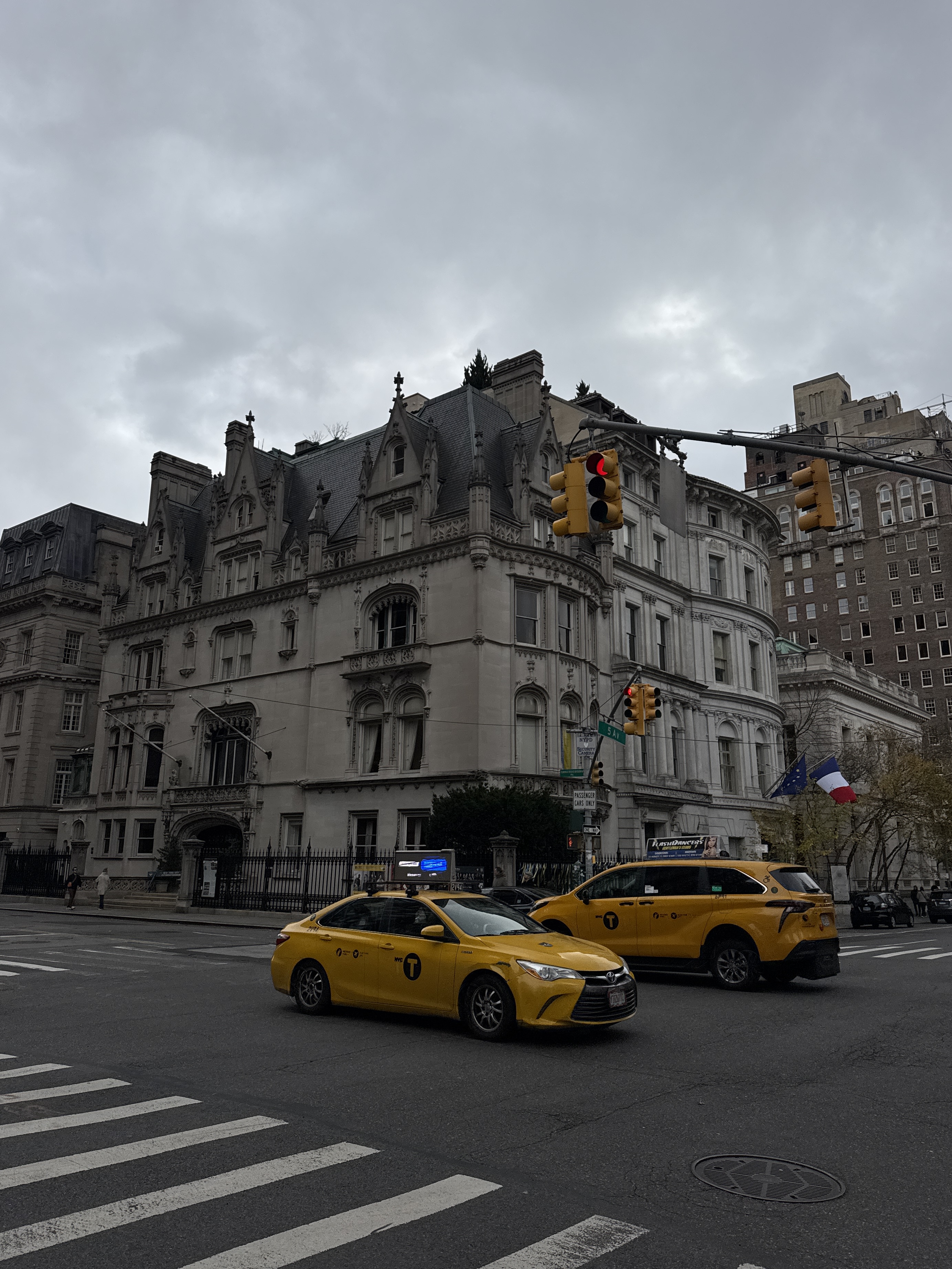 Building in upper east side new york city with taxi cabs 