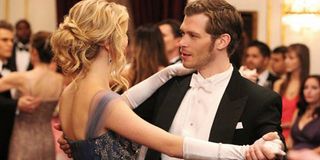 Candice King as Caroline Forbes and Joseph Morgan as Klaus Mikaelson in The Vampire Diaries.