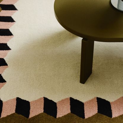 H&M tufted wool rug with a round green coffee table