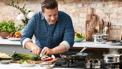 Jamie Oliver cookware: Jamie Oliver in kitchen with own cooking range