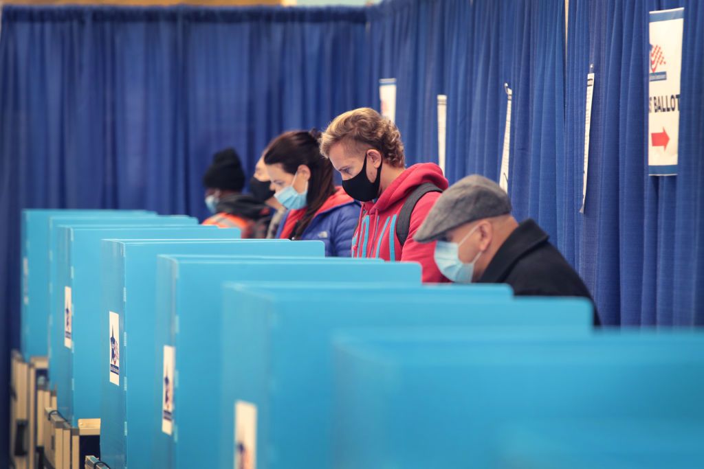 People voting with masks on.