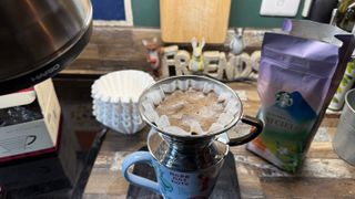 the kalita wave pour over coffee dripper in use with a gooseneck kettle