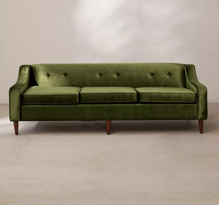 A green velvet sofa