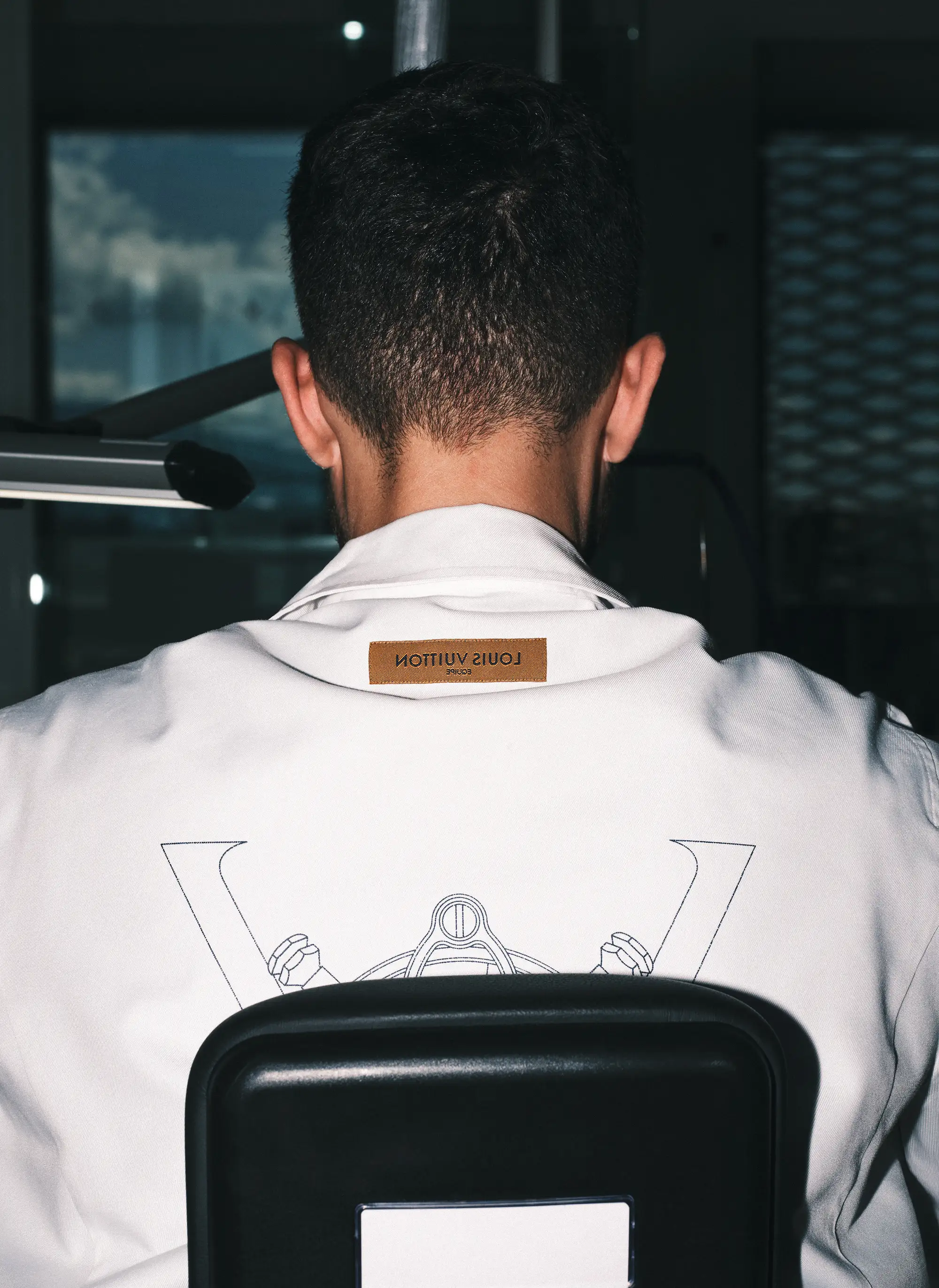The back of a man in a lap coat