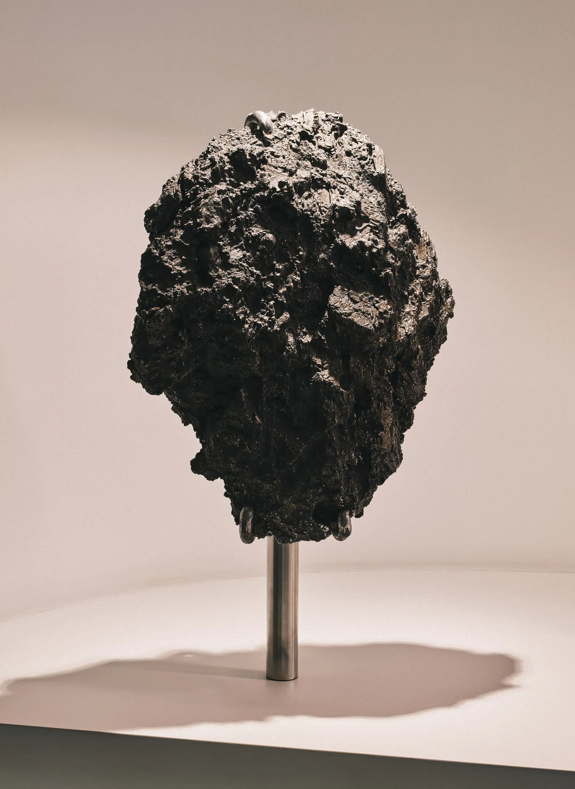 A piece of black raw meteorite