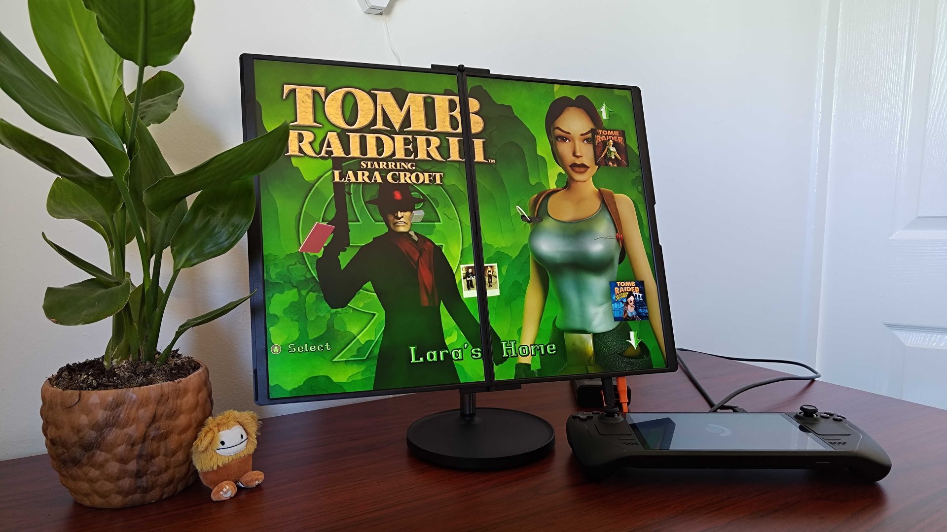 Jsaux FlipGo with Tomb Raider 2 menu spread across both screens