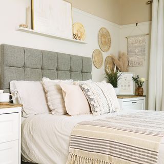 neutral bedroom with grey upholstered bed