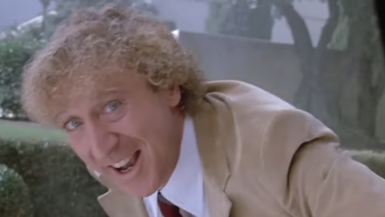 Gene Wilder leaning over and smiling in The Woman In Red