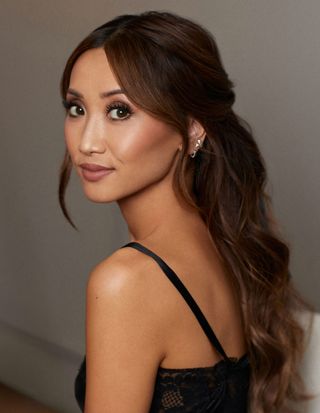 Brenda Song looks over her shoulder while wearing her Chanel dress