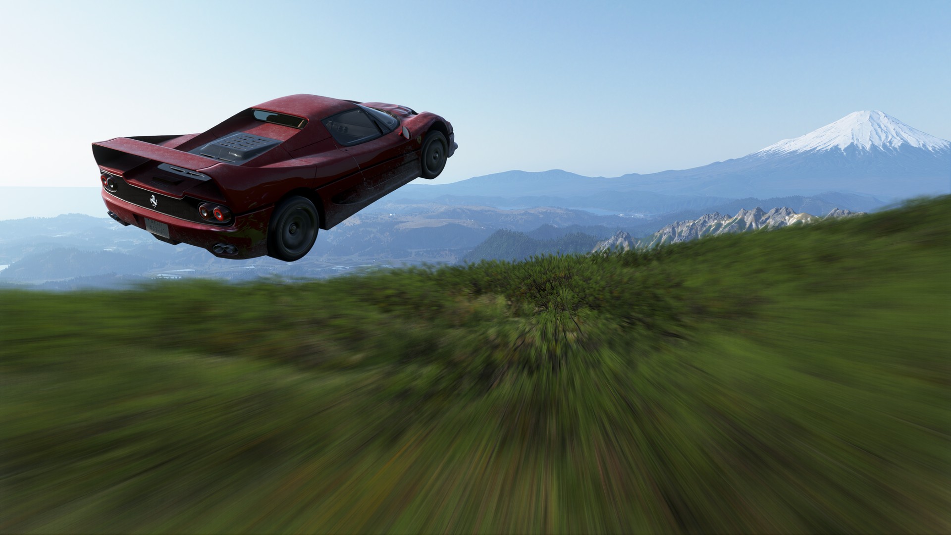 A red car soars above a lush green forest towards Mt Fuji in Forza Horizon 6, the speed blurring the view