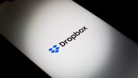 Dropbox logo and branding displayed on a smartphone screen with black background.