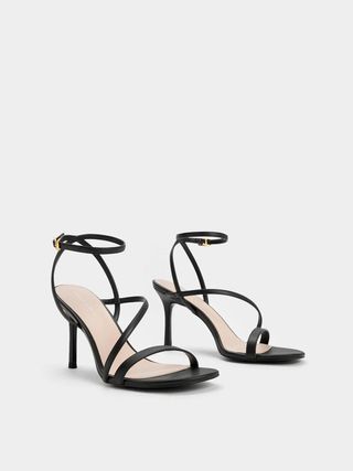 Charles 
Keith + Asymmetric Strappy Heeled Sandals