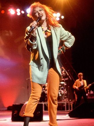 singer in blazer.