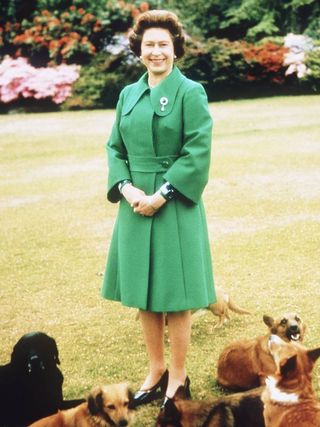 Queen Elizabeth in green skirt suit.