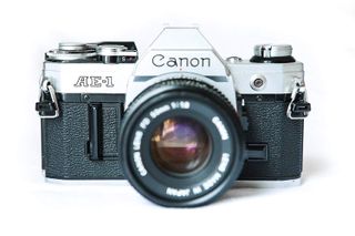 Canon + AE-1 35mm Film Camera w/ 50mm 1:1.8 Lens