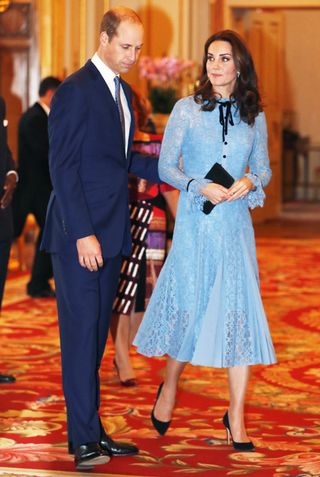 kate-middleton-just-debuted-her-baby-bump-in-a-pretty-lace-dress-2457884