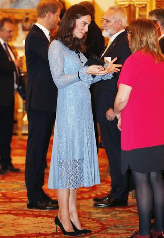kate-middleton-just-debuted-her-baby-bump-in-a-pretty-lace-dress-2457885