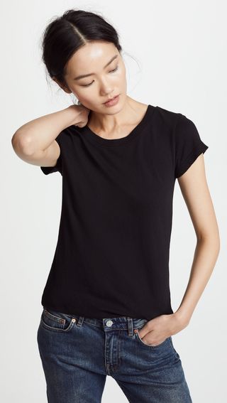 a model wears a black T-shirt with short sleeves