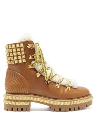 Christian Laboutin + Yeti Donna faux-fur trim studded leather boots