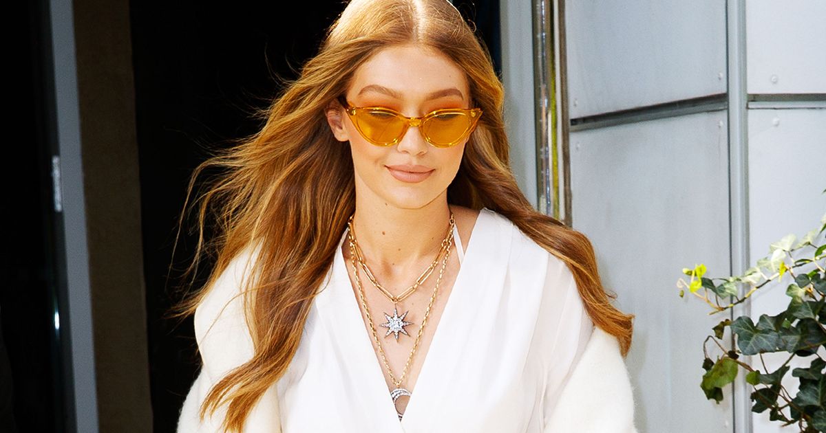 gigi hadid shirt dress Gigi Hadid Demonstrates How to Wear a Sweater Dress Over Jeans