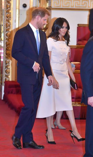 meghan-markle-just-wore-princess-dianas-signature-outfit-to-buckingham-palace-2845699