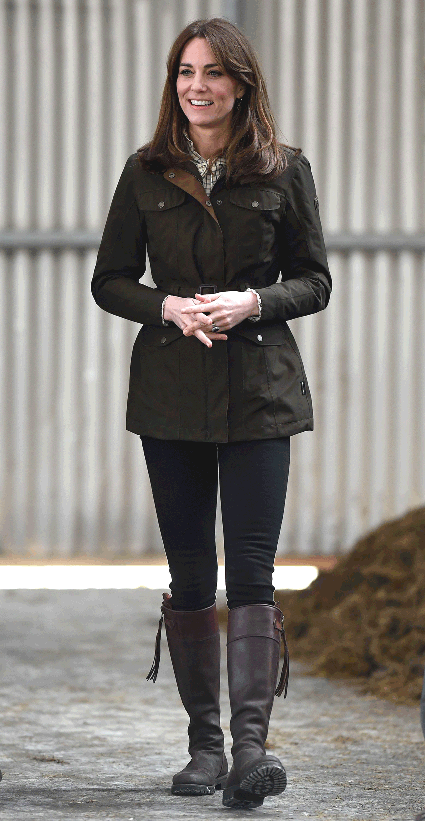 the best riding boots shown in a photo of Kate Middleton wearing a green barn jacket with black skinny jeans and brown knee-high riding boots