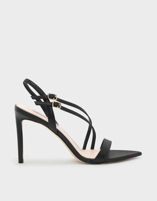 Charles 
Keith + Pointed Toe Asymmetrical Strap Stilettos