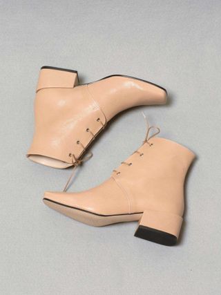 About Arianne + Gabriel Boots in Nude