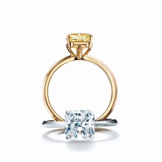 Tiffany 
Co. + Tiffany True engagement ring in 18k gold with a fancy yellow diamond. Tiffany True engagement ring in platinum with a white diamond.