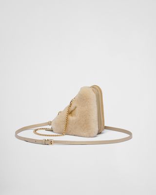 Prada + Triangular shearling and Saffiano leather mini-pouch
