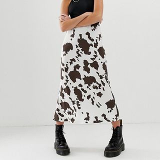 ASOS Design + Bias Cut Midi Slip Skirt in Cow Print