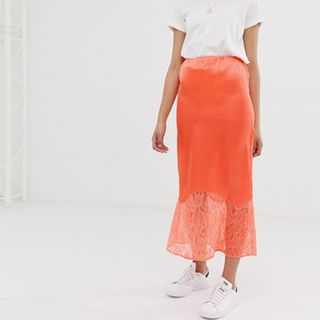 ASOS Design + Bias Cut Satin Midi Slip Skirt With Lace Hem in Neon Orange