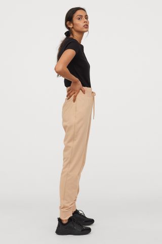 H&M + Cotton-Blend Joggers in Apricot