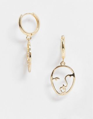 ASOS Design + Hoop Earrings With Abstract Face Charm in Gold Tone