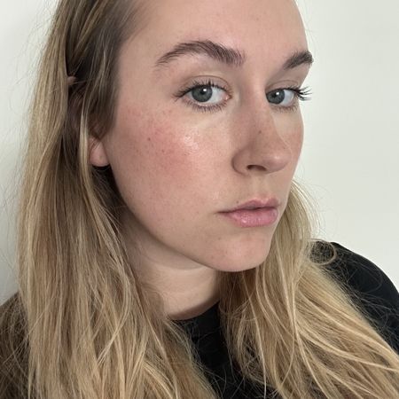 A selfie of Who What Wear beauty editor Kaitlyn McLintock with long, curled lashes.