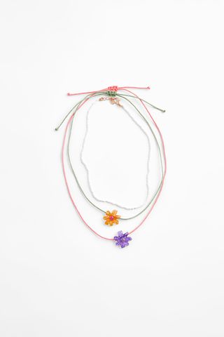 Zara + Pack of Resin Daisy Necklaces