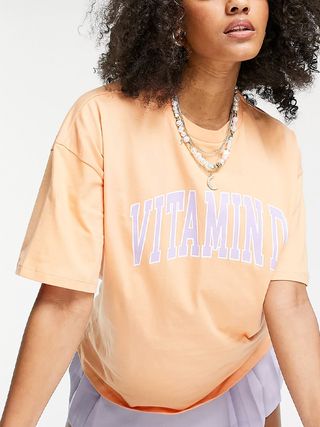 ASOS Design + Oversized T-Shirt With Vit-D Graphic in Washed Coral