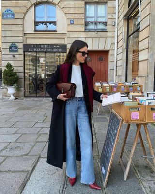 jeans styled with a burgundy sweater