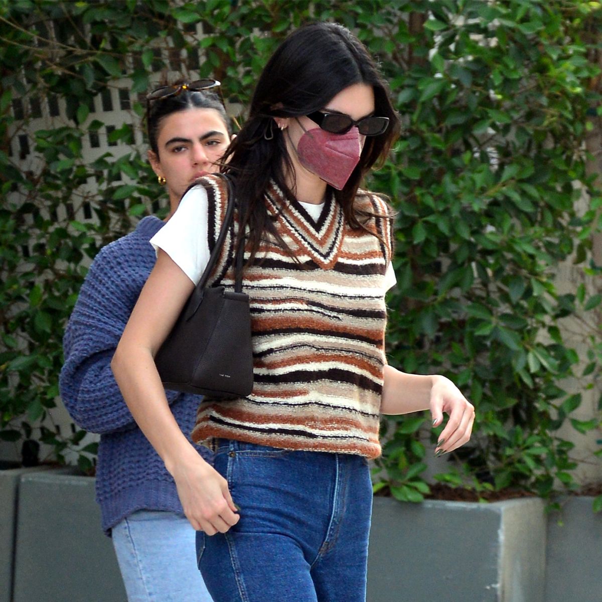 Kendall Jenner cuts a casual figure in an oversized blue jumper as
