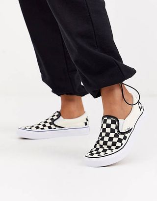 Vans + Classic Slip-On Checkerboard Trainers in Black/White