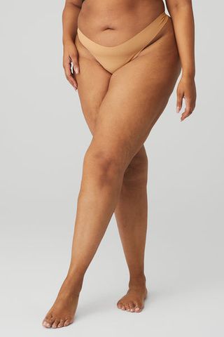 Alo Yoga + Airbrush Invisible Thong in Sand