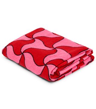 a red and pink patterned towel