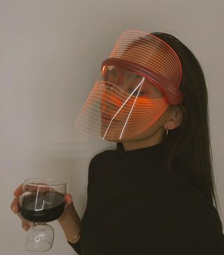 Woman wearing an LED face mask