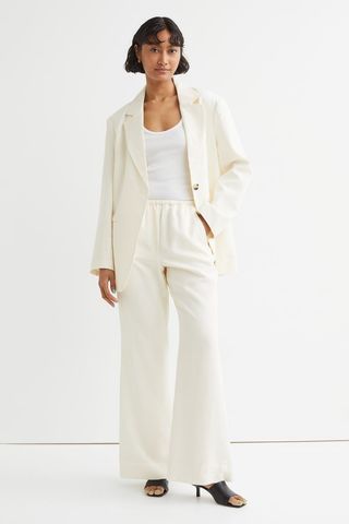 H&M + Flared Lyocell-Blend Trousers