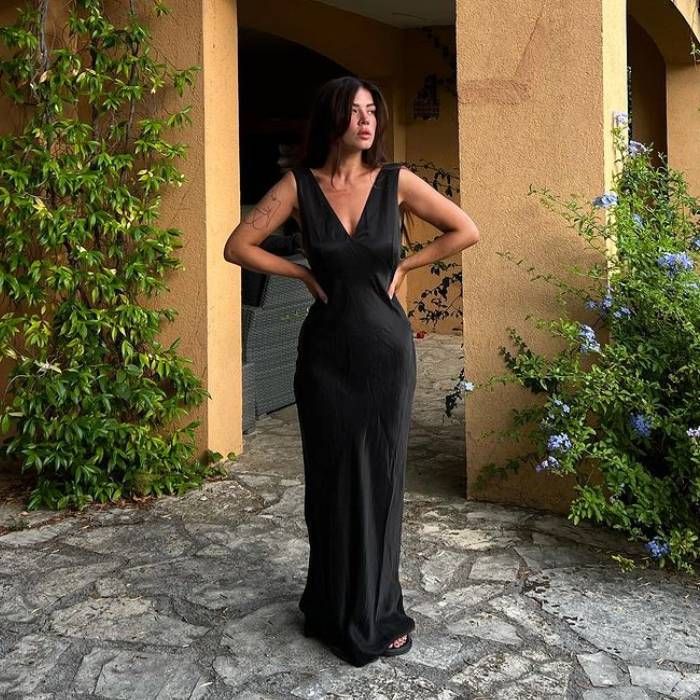 cool lady in a long black dress 11 Long Black Dresses to Replace the LBD