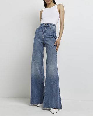 River Island + Blue High Waisted Ultra Flared Jeans