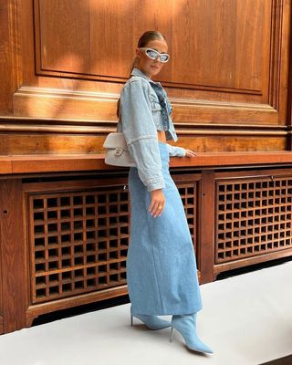 a phot of a woman's outfit with a long denim skirt with matching denim jacket and denim boots